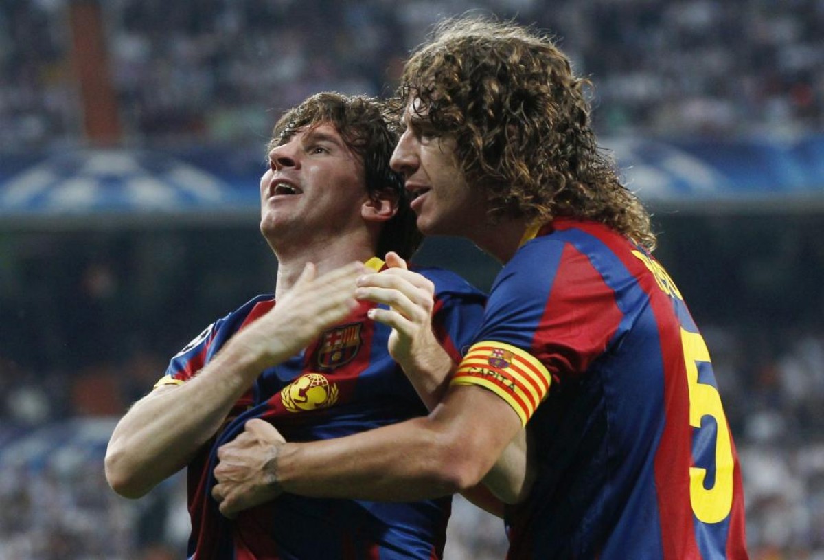 Messi i Puyol, celebrant un gol - Europa Press