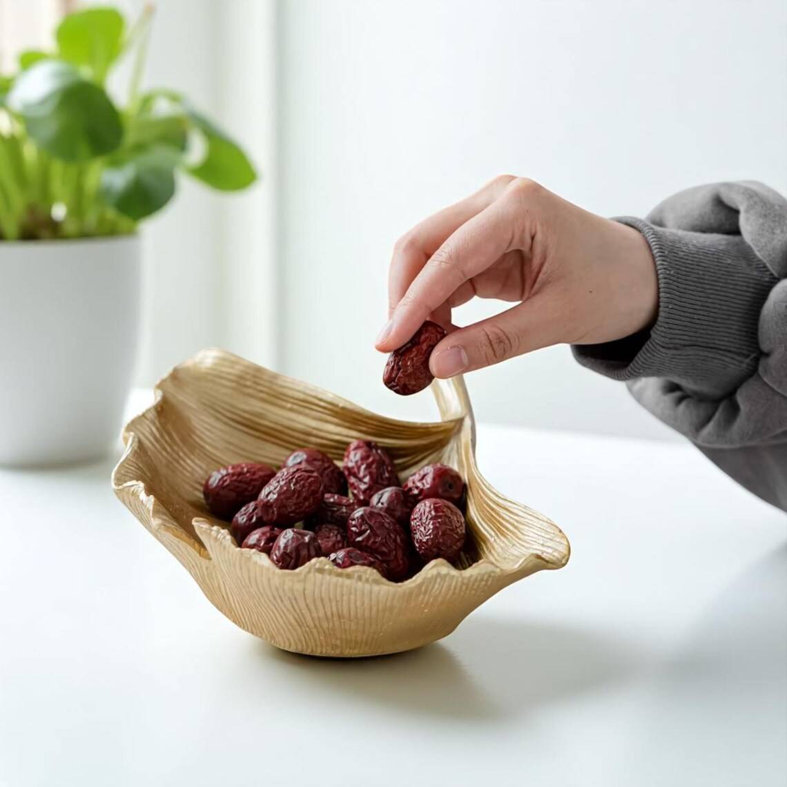 Una opció ideal per a espais tranquils i molt naturals. Imita una fulla de ginkgo i està elaborada amb resina resistent - 